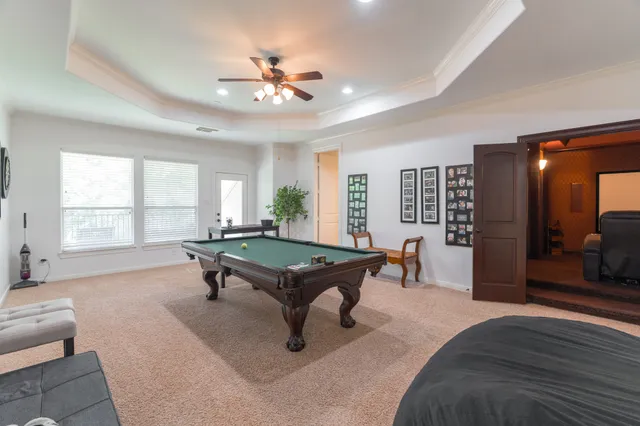 a living room with furniture a table and window