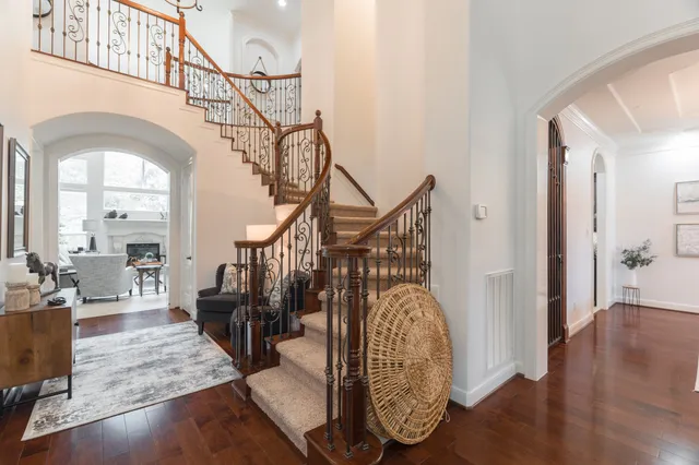 a view of entryway and hall with wooden floor