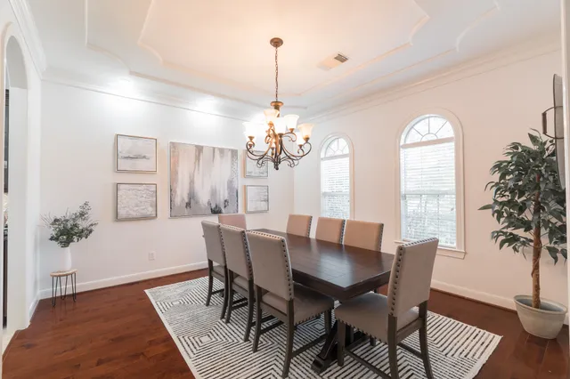 a view of a dining room with furniture and window