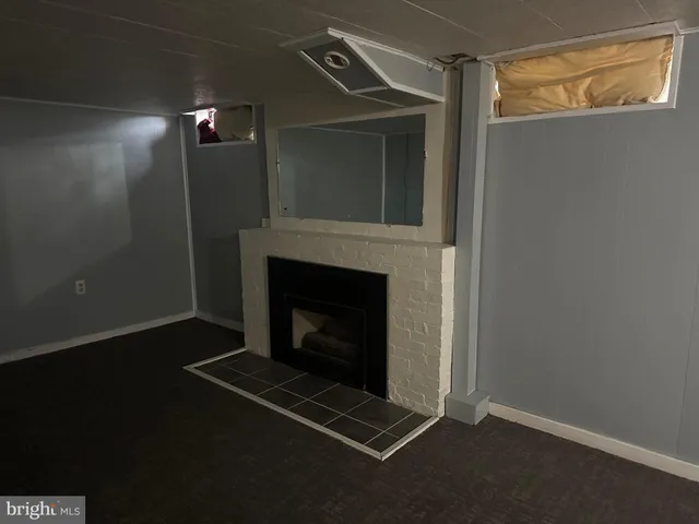 a living room with a fireplace