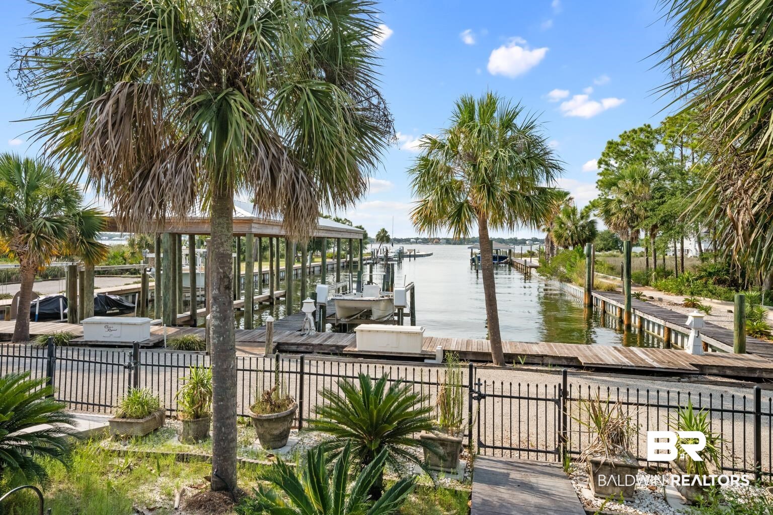 29255 Ono Boulevard Orange Beach, AL 36561 - Photo 15 of 43 Dock with a water view and boat lift