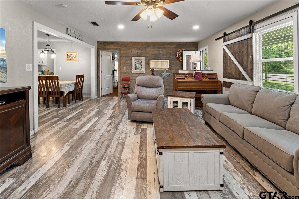 403 Kennedy Street Lindale, TX 75771 - Photo 11 of 36 a living room with furniture and wooden floor