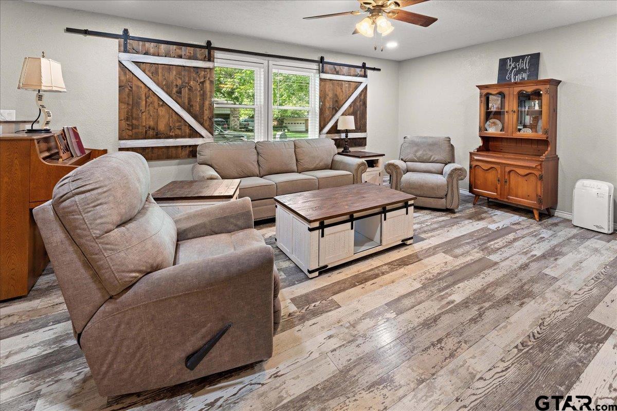 403 Kennedy Street Lindale, TX 75771 - Photo 12 of 36 a living room with furniture and a large window