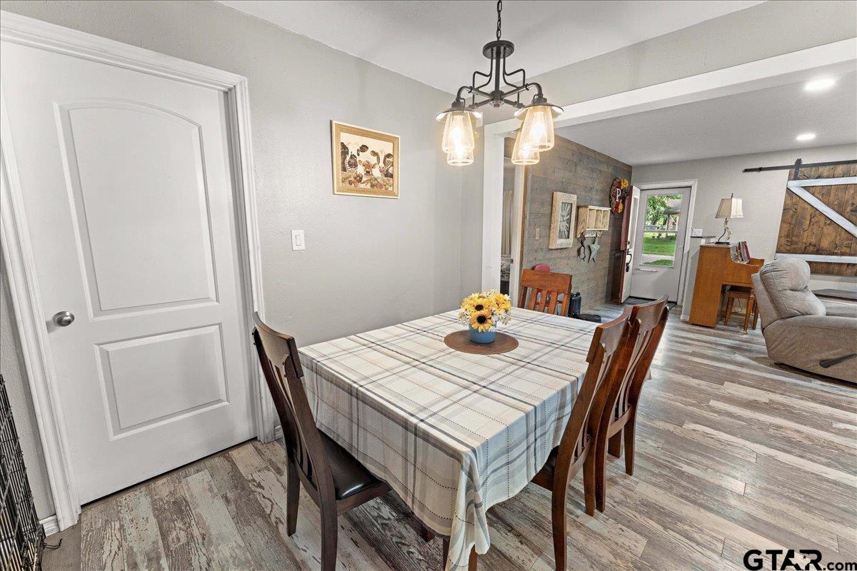 403 Kennedy Street Lindale, TX 75771 - Photo 20 of 36 a view of a dining room with furniture window and wooden floor