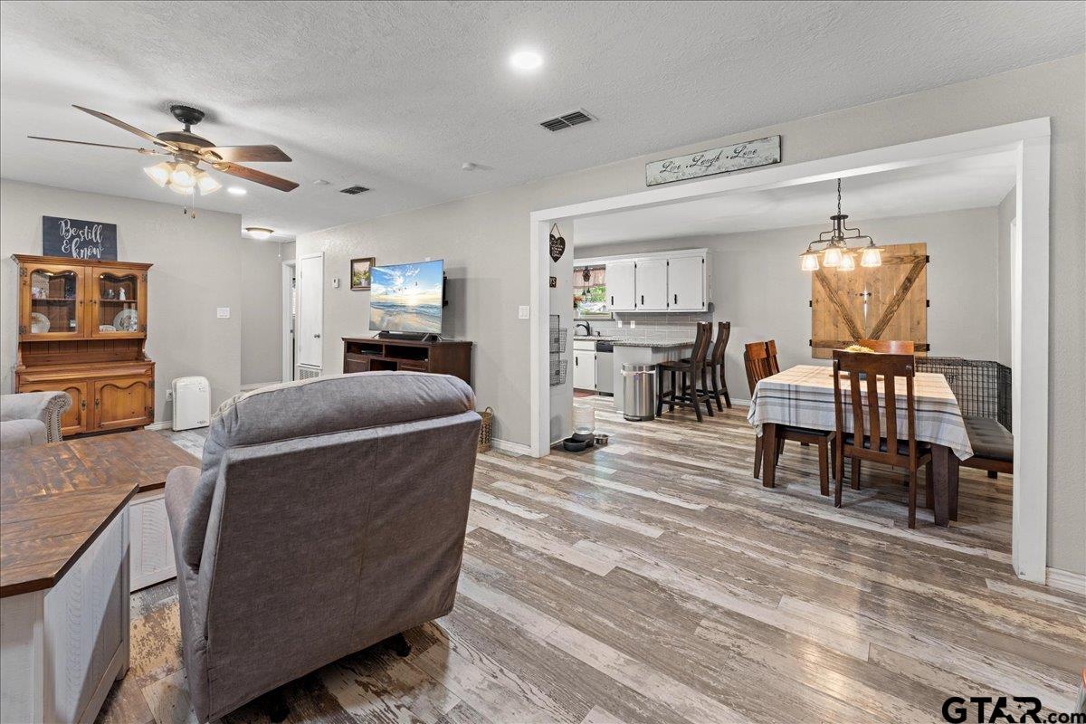 403 Kennedy Street Lindale, TX 75771 - Photo 2 of 36 a living room with furniture and a wooden floor