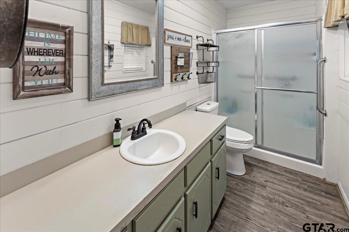 403 Kennedy Street Lindale, TX 75771 - Photo 24 of 36 a bathroom with a sink toilet and shower