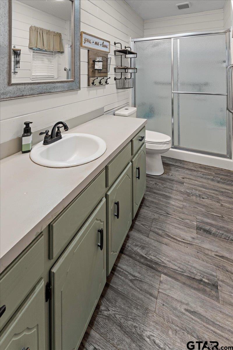 403 Kennedy Street Lindale, TX 75771 - Photo 25 of 36 a bathroom with a sink and mirror