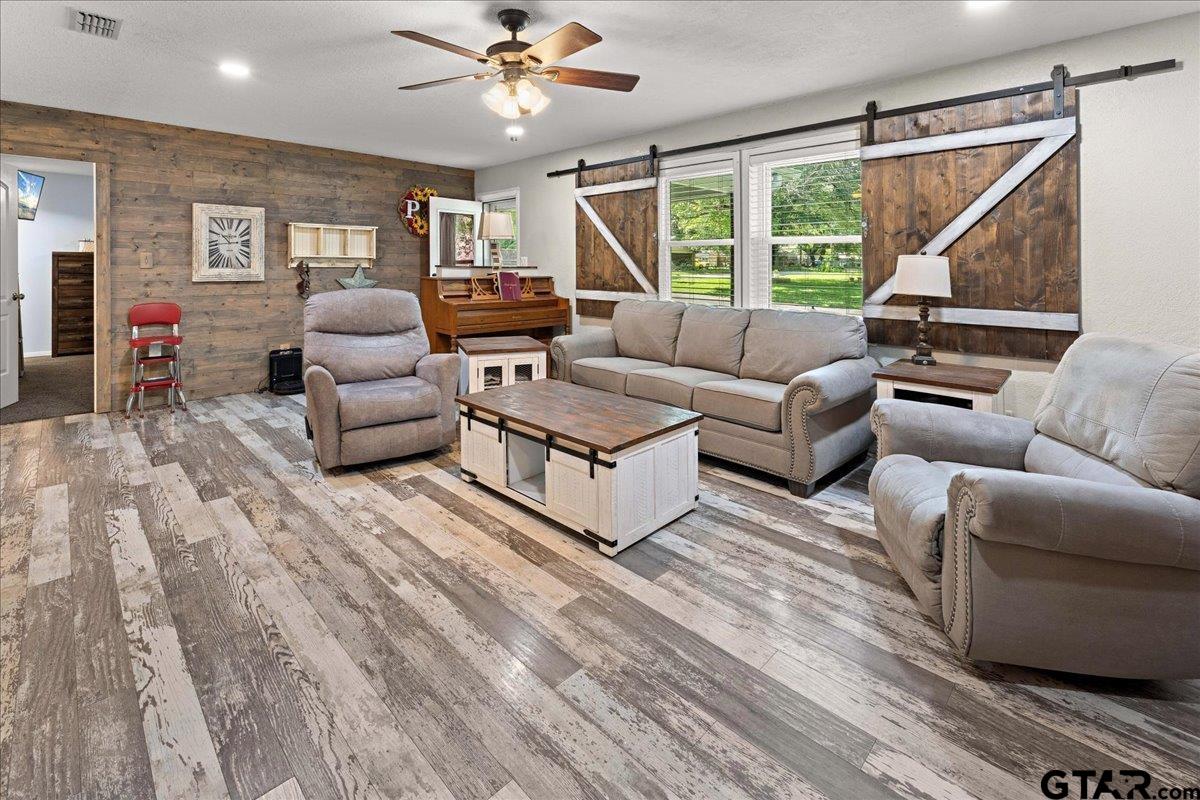 403 Kennedy Street Lindale, TX 75771 - Photo 4 of 36 a living room with furniture and a large window