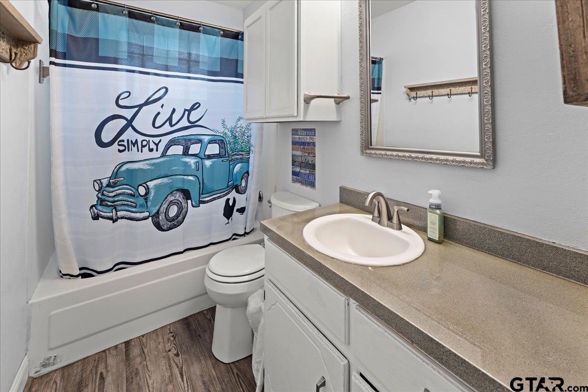 403 Kennedy Street Lindale, TX 75771 - Photo 7 of 36 a bathroom with a sink and a toilet