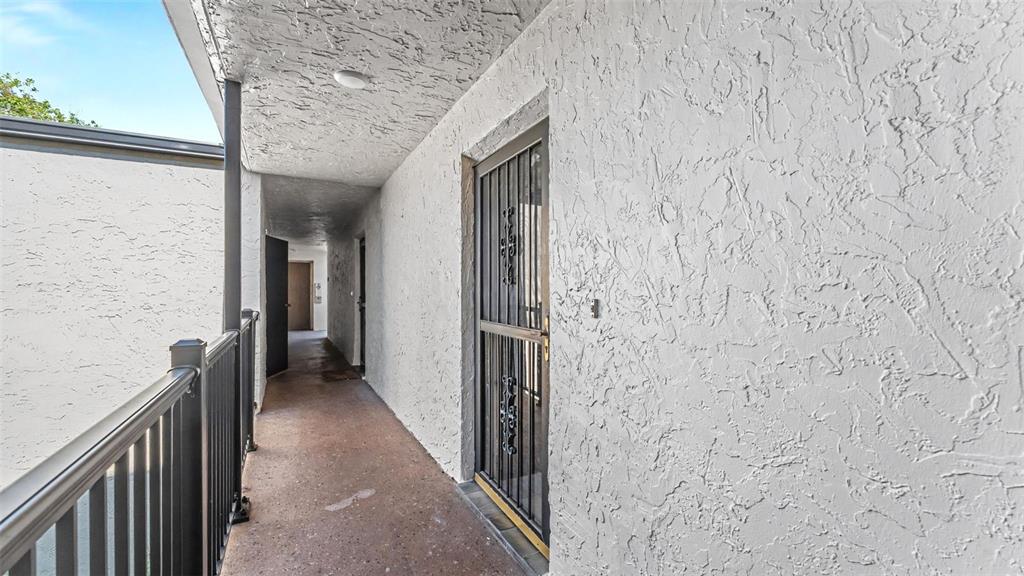 2025 Sylvester Road, Unit N305 Lakeland, FL 33803 - Photo 6 of 34 a view of hallway with wooden floor