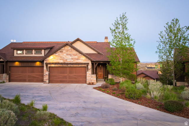 1737 East Viewside Circle Hideout, UT 84036 - Photo 28 of 35 Stone and wood-sided residence featuring a multi-gabled roofline and a concrete driveway