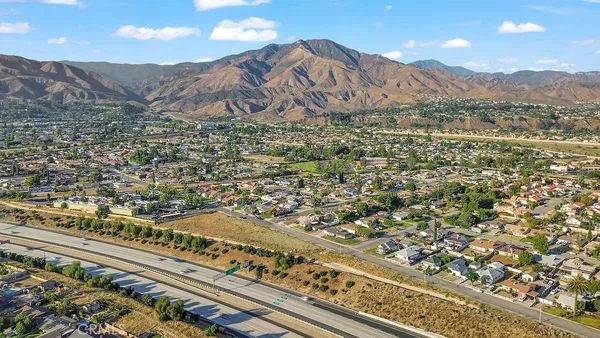 an aerial view of residential building and ocean view