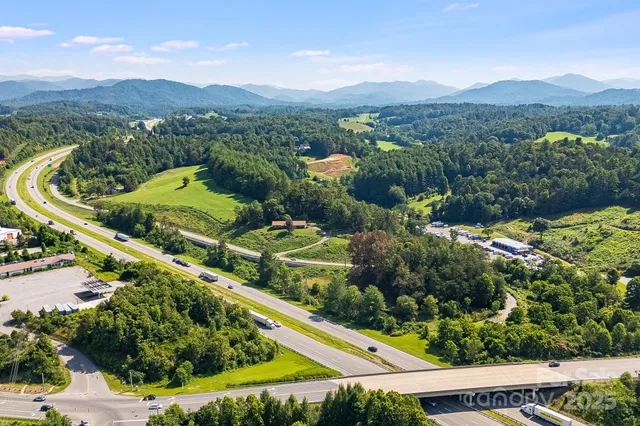 a view of a swimming pool with a yard