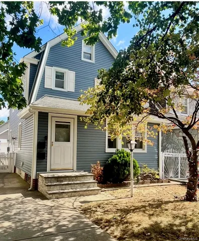 a view of a house with a snow in the background