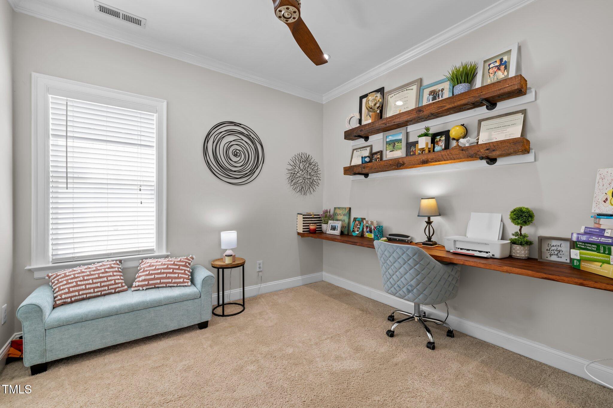 7829 ACC Boulevard Raleigh, NC 27617 - Photo 34 of 51 Currently being used as an office. Custom desk and shelving.