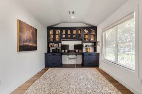 a spacious bathroom with a double vanity sink and a mirror