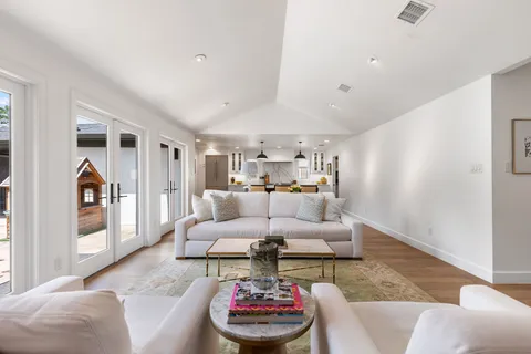 a living room with furniture and a rug