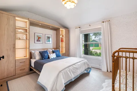 an empty room with windows and closet