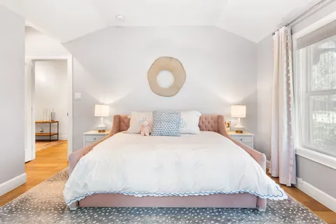 a bathroom with a double vanity sink mirror and toilet