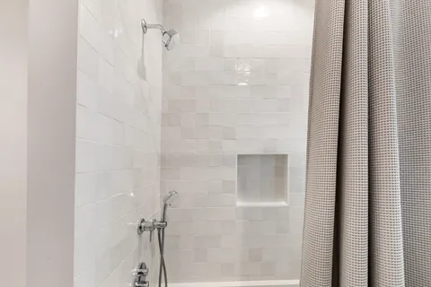 a bedroom with furniture and a rug