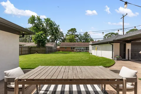a view of a backyard with a garden and plants