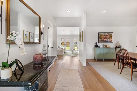 a view of a living room and dining room