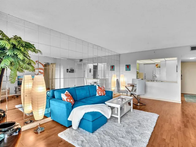 a bathroom with a sink mirror vanity and toilet