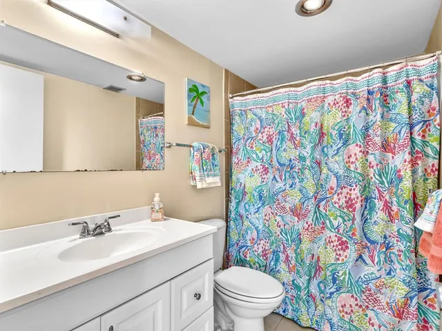 a bedroom with a bed and a table in it