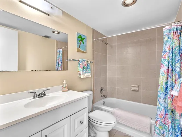 a large white bed in a white room