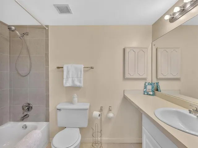 a bedroom with a bed and flat screen tv