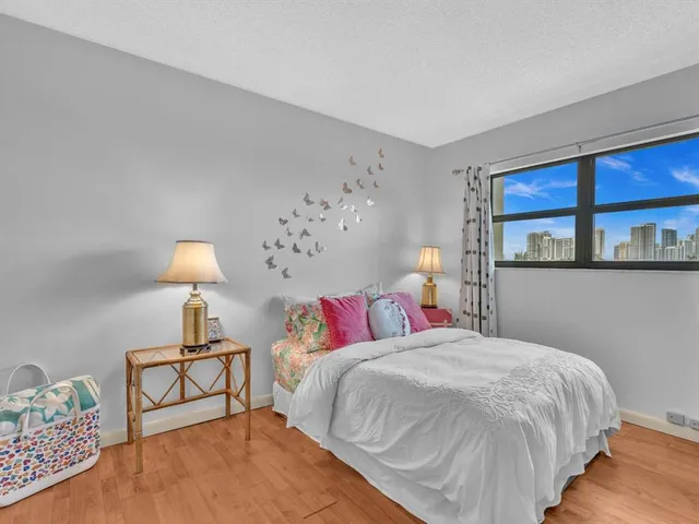 a view of a balcony with wooden floor