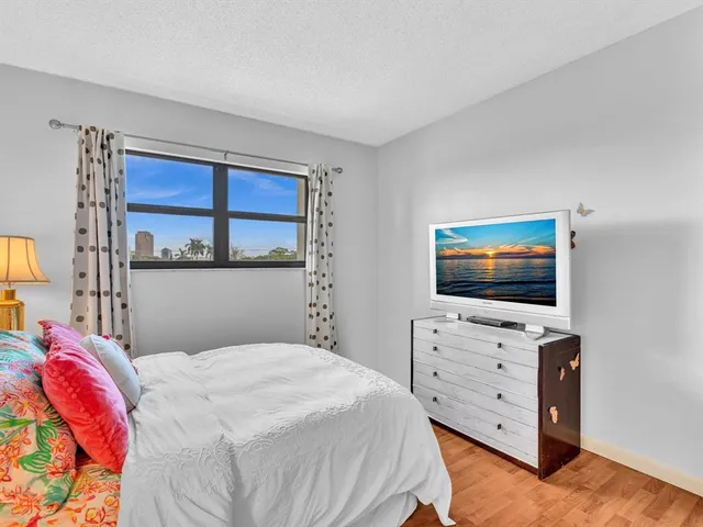 a view of a balcony with furniture and wooden floor