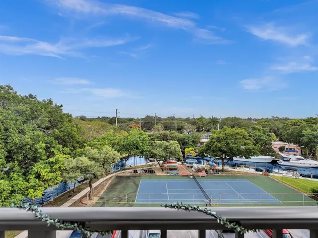 a kitchen with granite countertop white cabinets and a sink