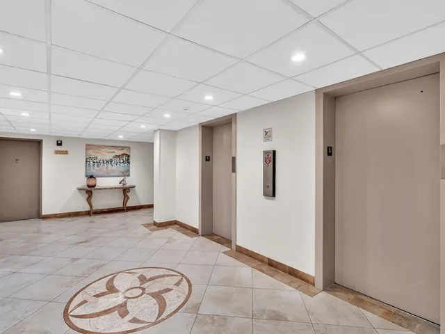 a kitchen with kitchen island a counter top space and cabinets