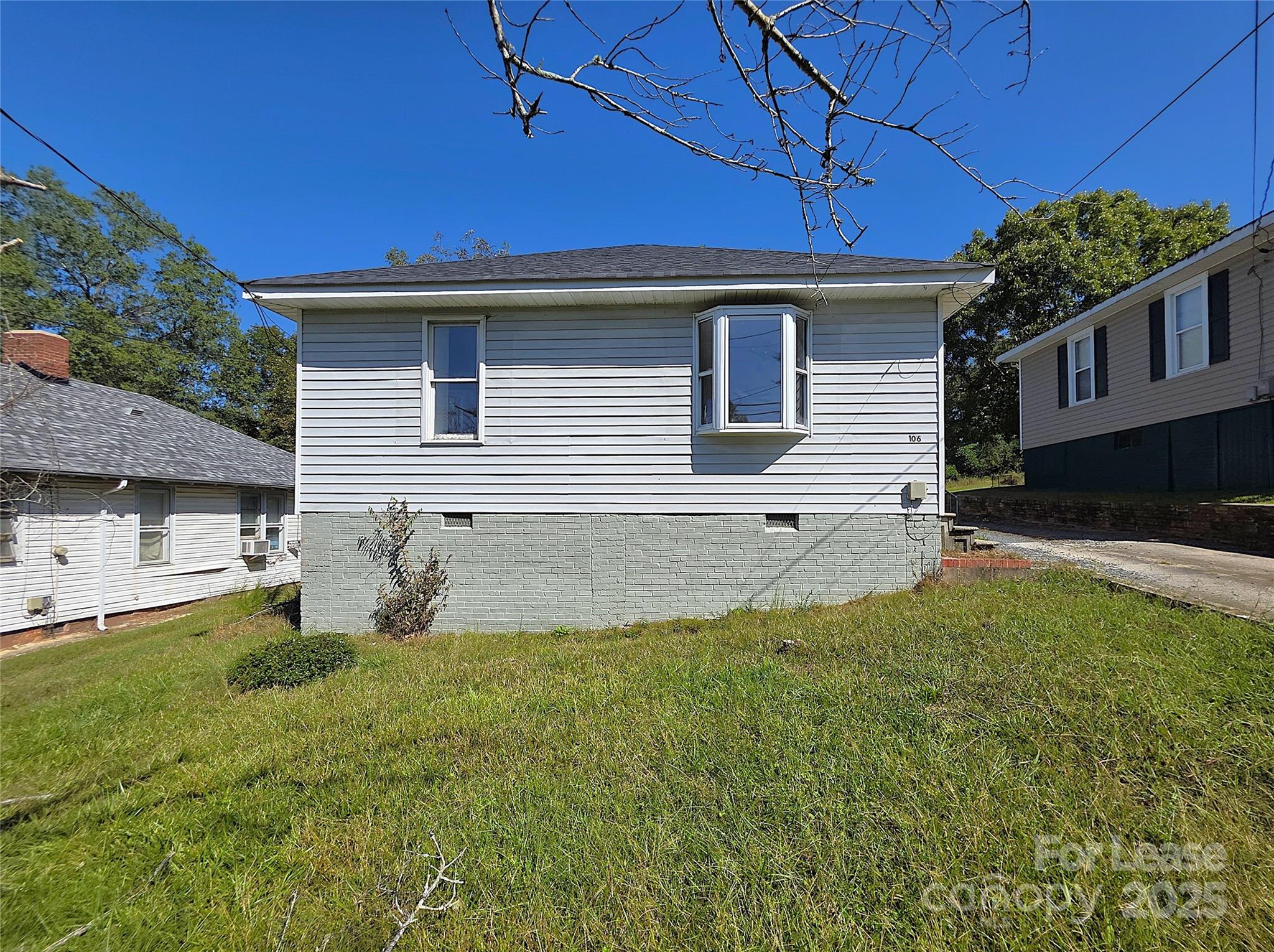 106 Falls Road Badin, NC 28009 - Photo 2 of 19 a front view of a house with a yard