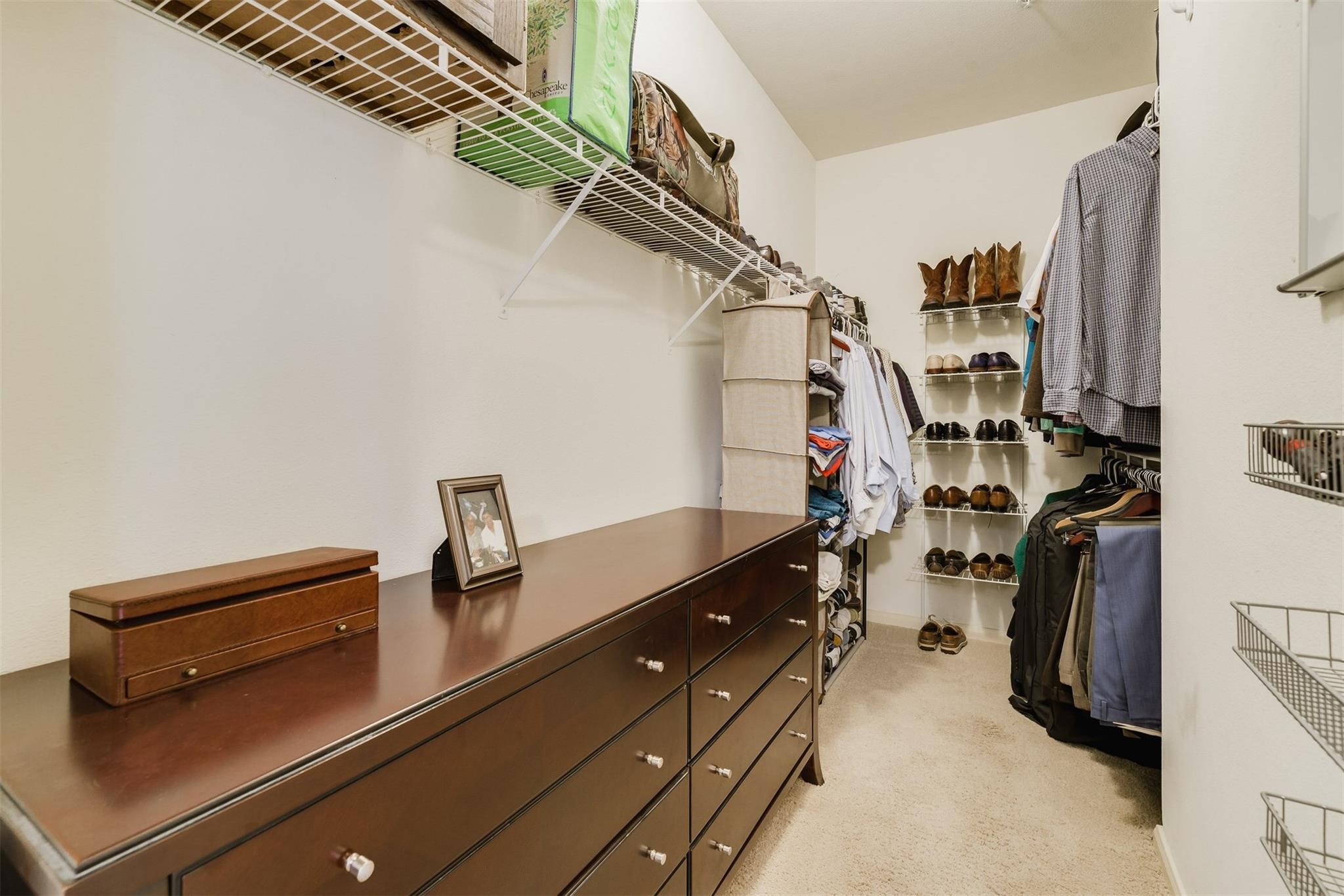 3231 Allen Parkway, Unit 1110 Houston, TX 77019 - Photo 11 of 17 a view of walk in closet with clothes and shoes
