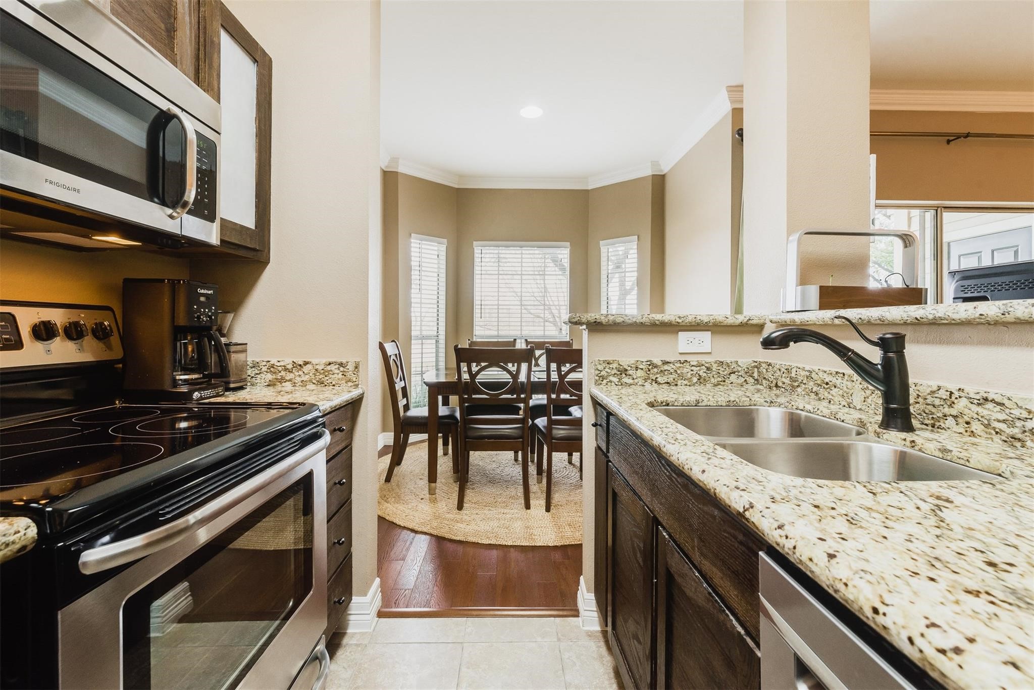 3231 Allen Parkway, Unit 1110 Houston, TX 77019 - Photo 5 of 17 Just off the kitchen, you’ll find a spacious dining area filled with natural light from large windows.
