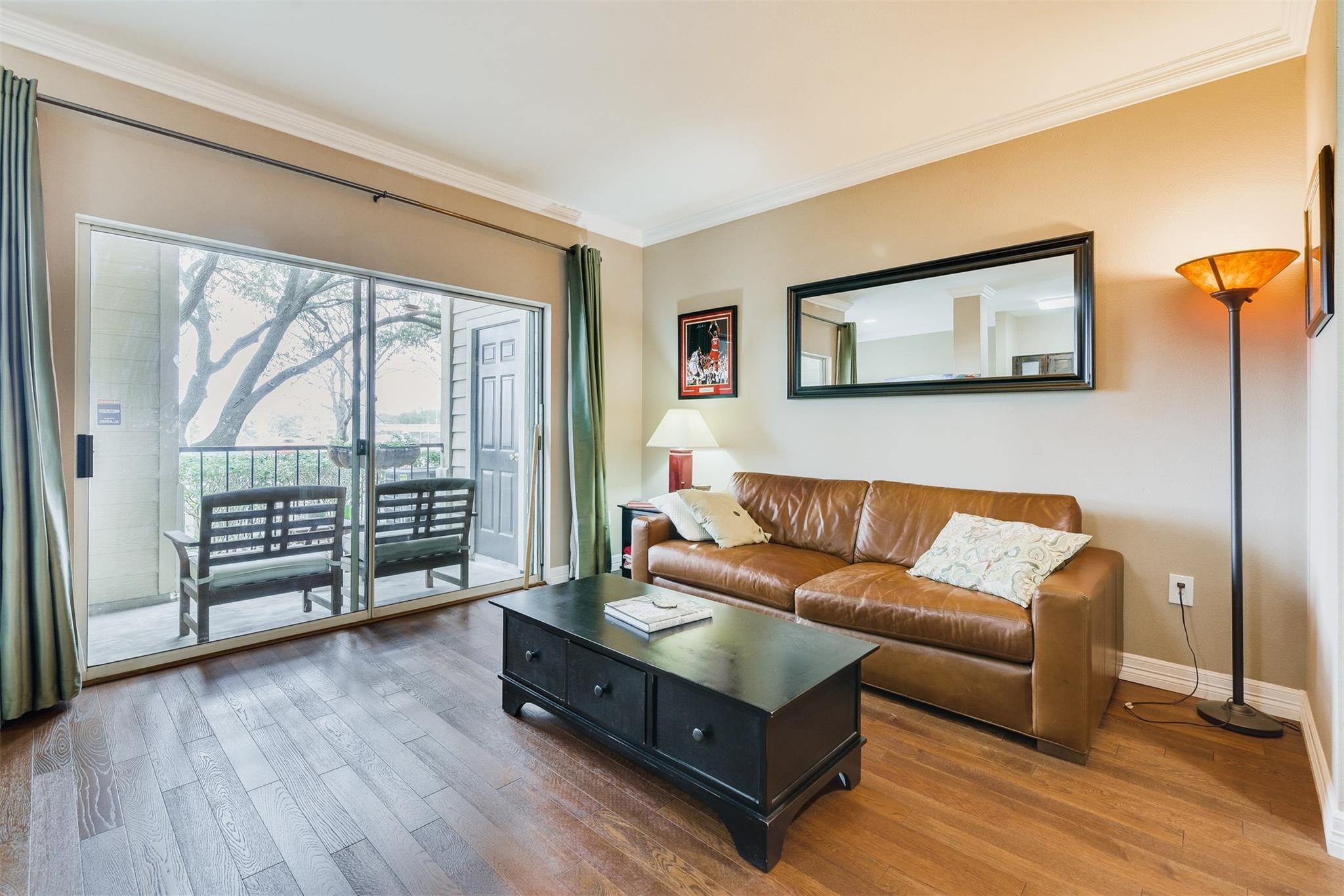 3231 Allen Parkway, Unit 1110 Houston, TX 77019 - Photo 7 of 17 Perfect for entertaining or unwinding, this home features a sliding door to a covered patio where you can relax and enjoy peaceful bayou views.