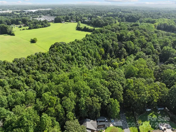an aerial view of a houses with yard