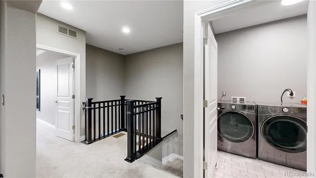 a view of entryway with washer and dryer