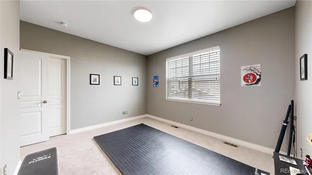 a view of a livingroom with wooden floor and window