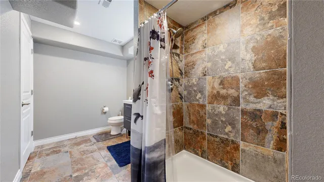 a bathroom with a bathtub and shower