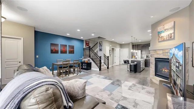a view of a livingroom with furniture and a fireplace