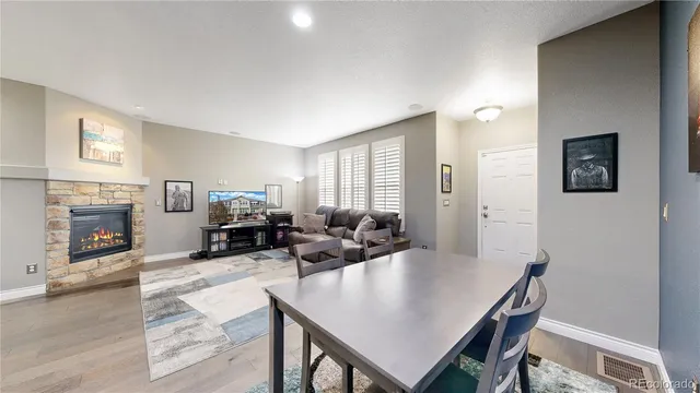 a view of a livingroom with furniture and a fireplace