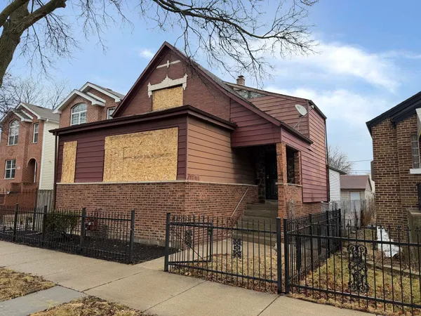 a front view of a house with garage