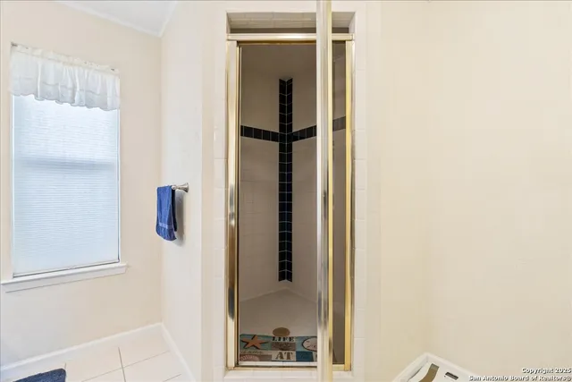 a view of a hallway with wooden floor and closet
