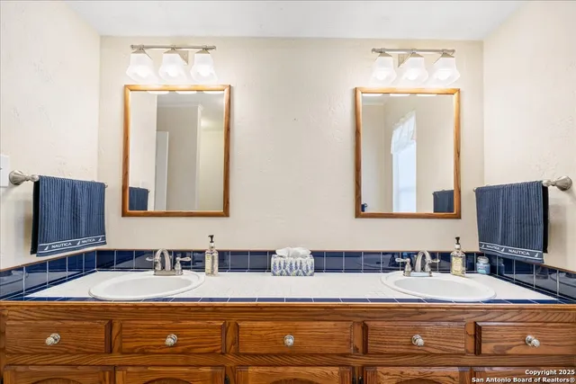 a bedroom with a bed and a mirror