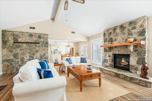a living room with furniture and a fireplace