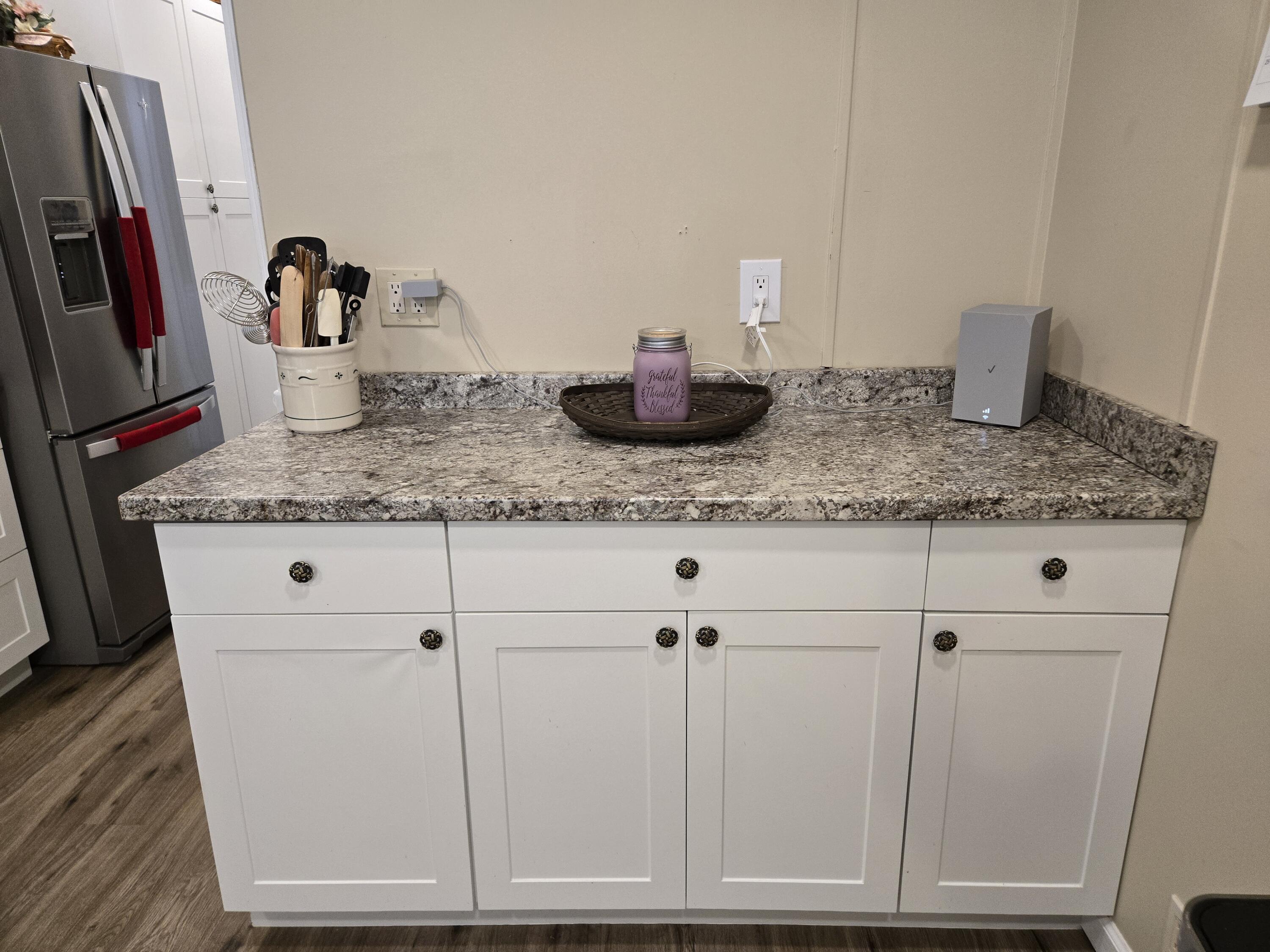 12240 Southeast 138th Avenue, Unit 225 Okeechobee, FL 34974 - Photo 13 of 50 a kitchen with cabinets and white appliances
