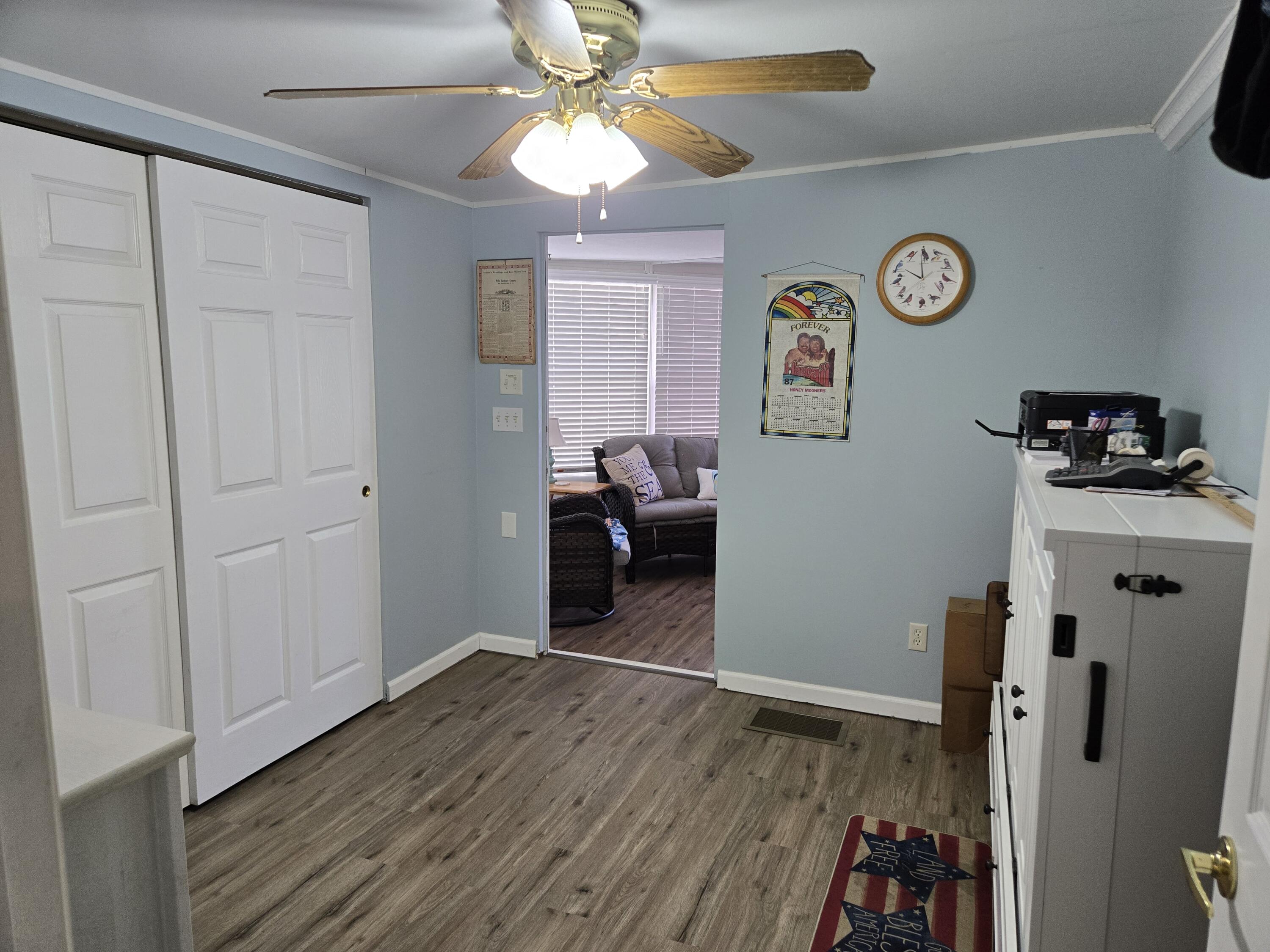 12240 Southeast 138th Avenue, Unit 225 Okeechobee, FL 34974 - Photo 24 of 50 a view of a livingroom with wooden floor